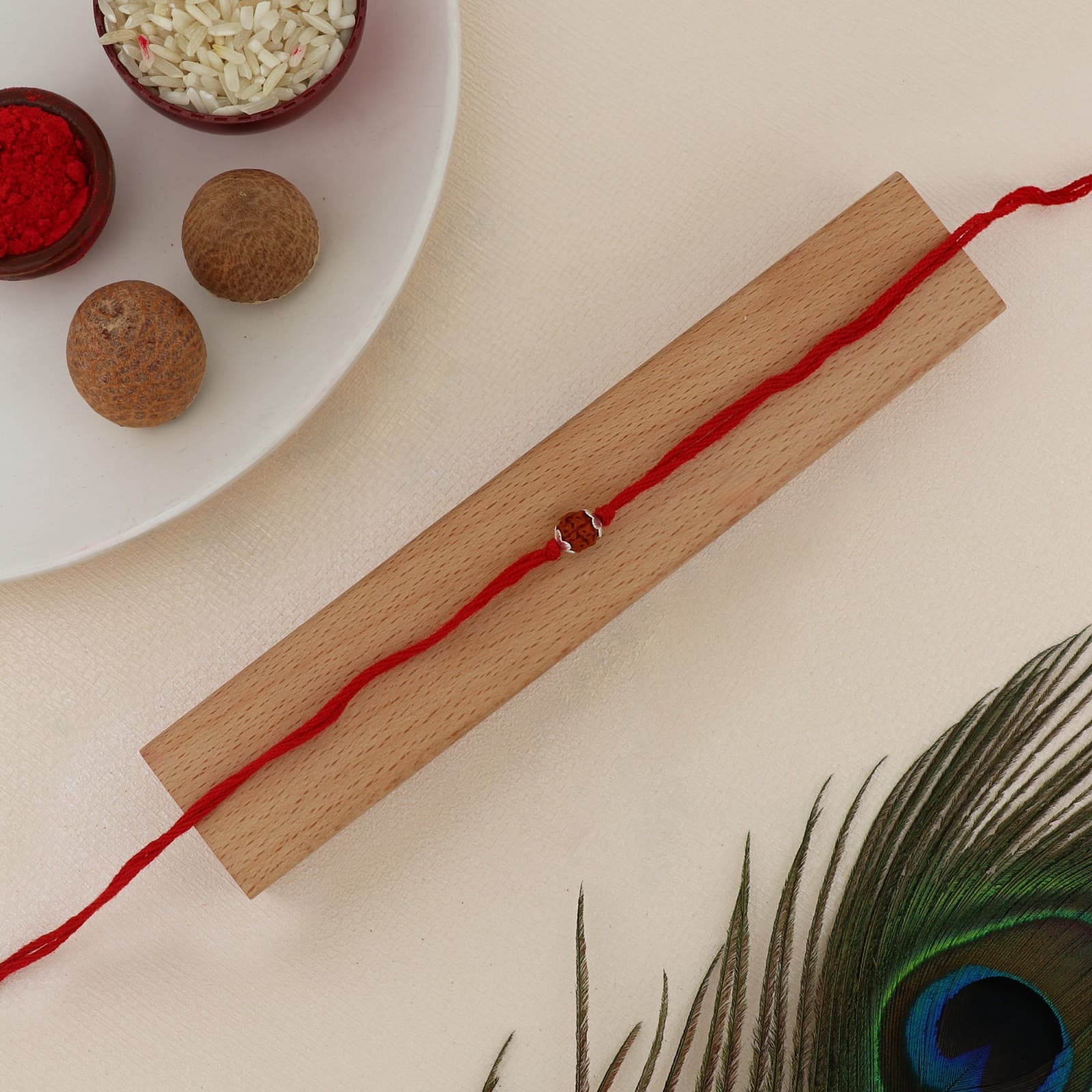 Silver Rudraksha Rakhi | Sacred Rudraksha Bead with Silver Accents | Adjustable Red Thread