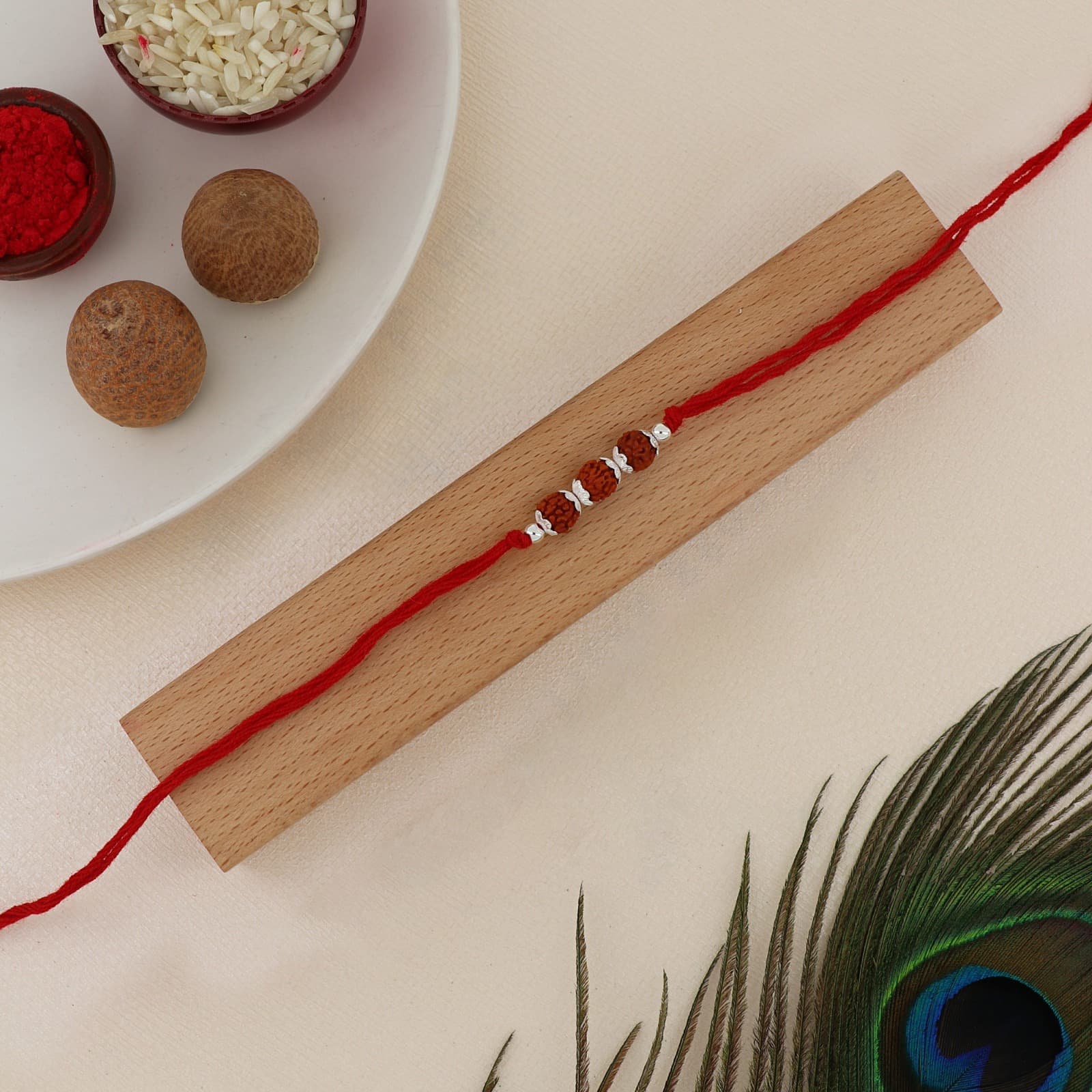 Silver Rudraksha Trio Rakhi | Sacred Rudraksha Beads with Silver Accents | Adjustable Red Thread