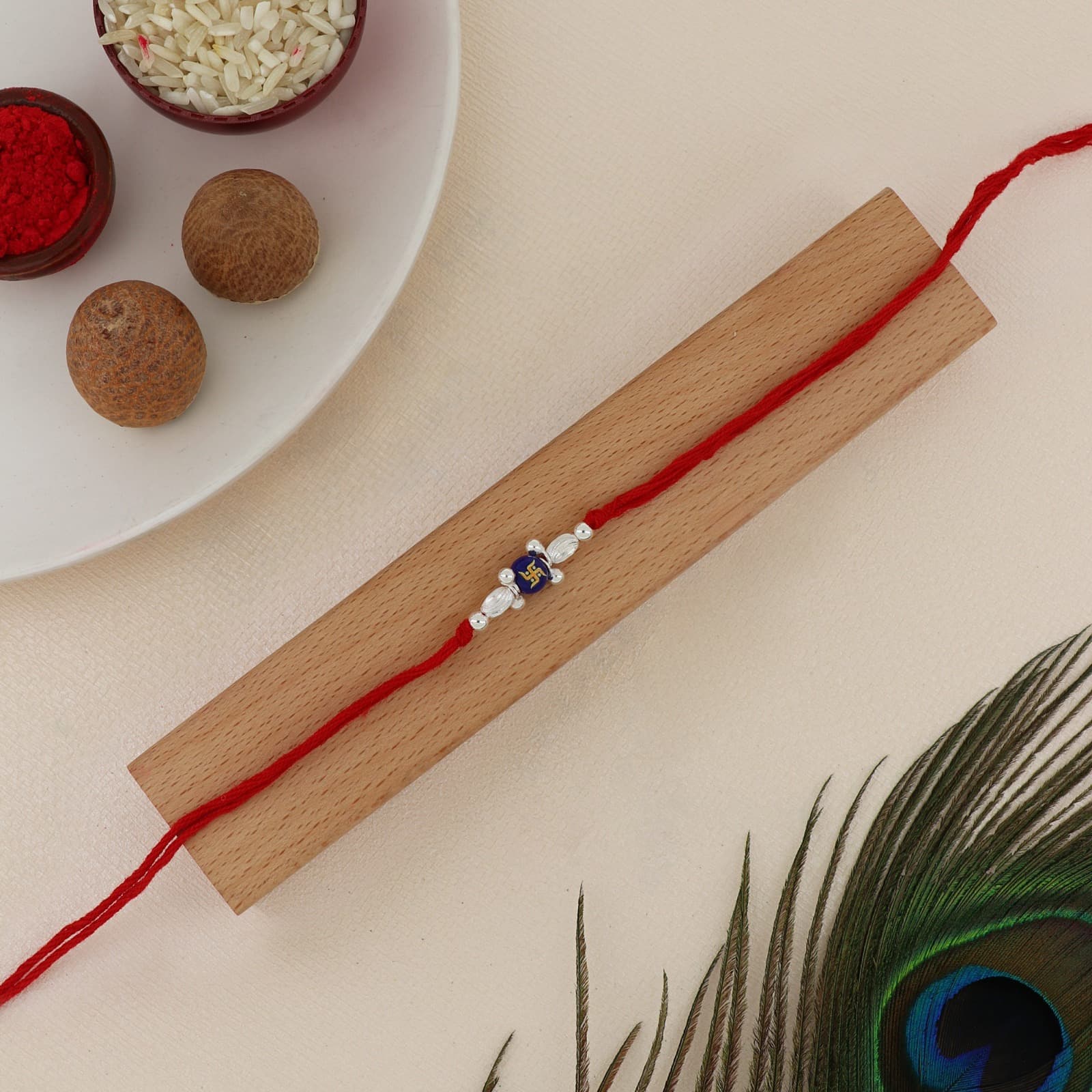 Silver Swastik Spiritual Rakhi | Blue Swastik Bead Rakhi with Designer Silver Beads | Adjustable Red Thread