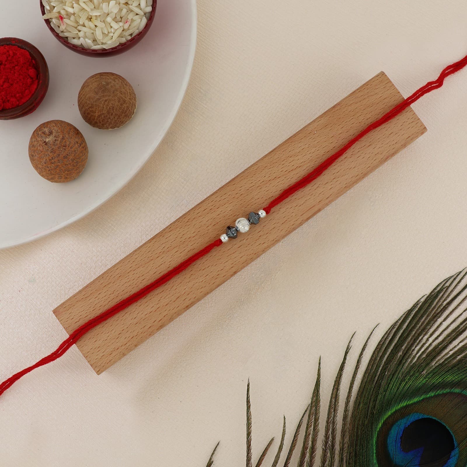 Silver Hematite Bead Rakhi | Ribbed Silver Center Bead with Hematite Accents | Adjustable Red Thread
