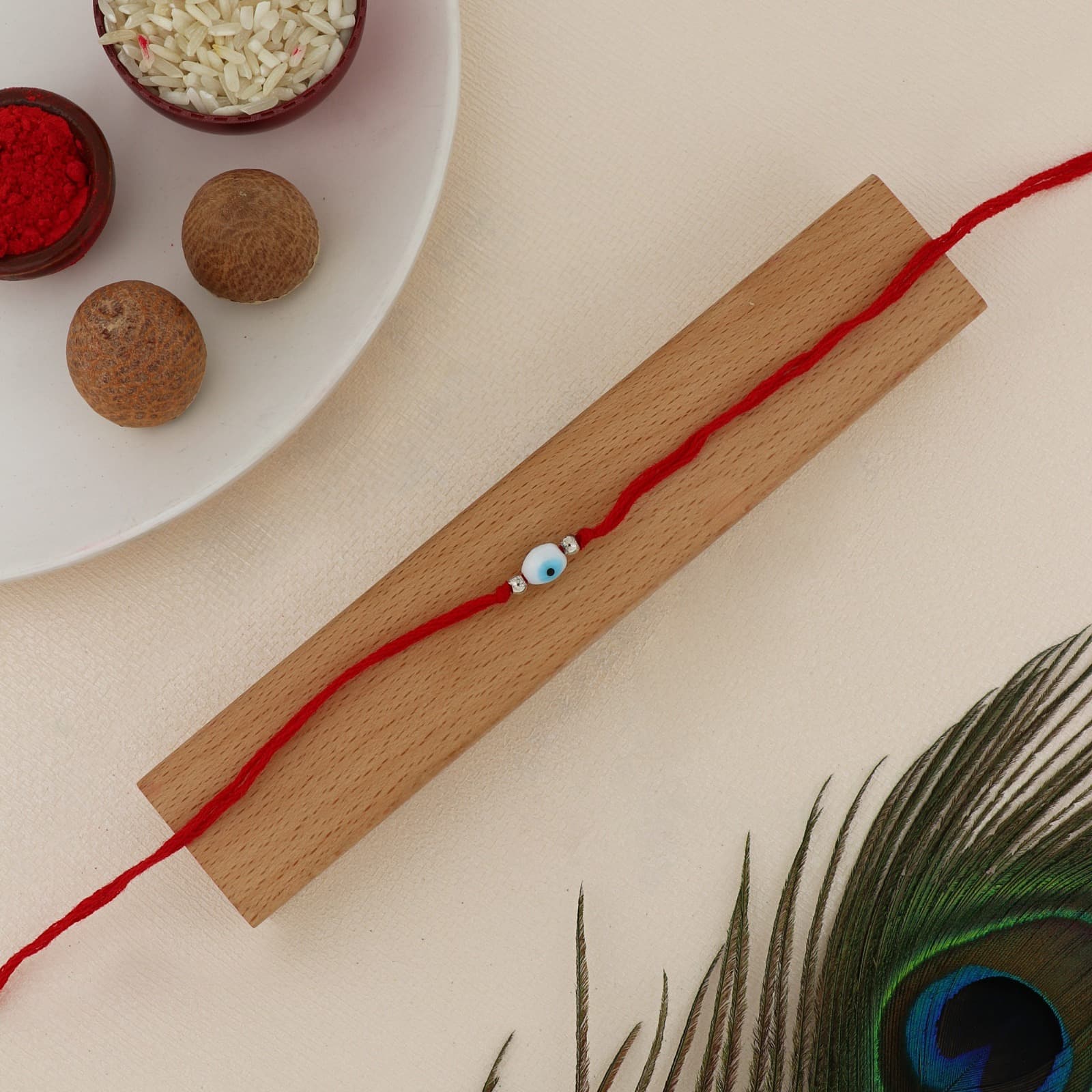 Silver Evil Eye Rakhi | Protective Evil Eye Bead with Crystal & Silver Accents | Adjustable Red Thread