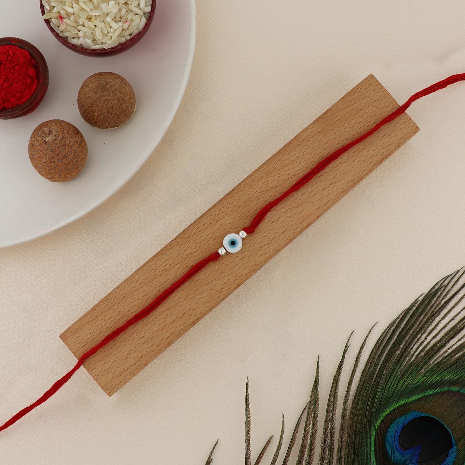Silver Evil Eye Rakhi | Protective Evil Eye Charm with Silver Accents | Adjustable Red Thread