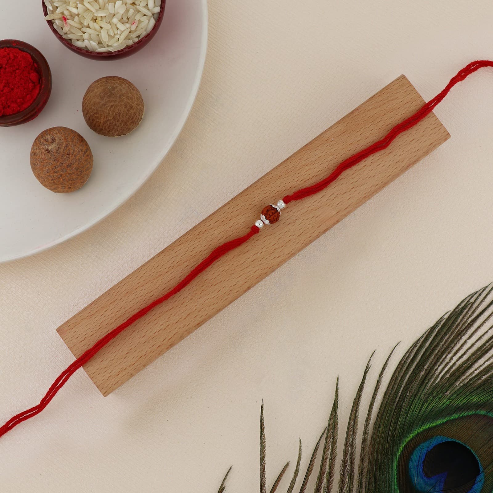 Silver Rudraksha Rakhi | Sacred Natural Rudraksha Bead with Silver Accents | Adjustable Red Thread
